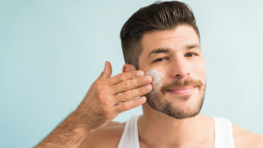 A man applying Heaven Roots Nia Defense matte sunscreen for men with oily skin to ensure a non-greasy, clear finish.
